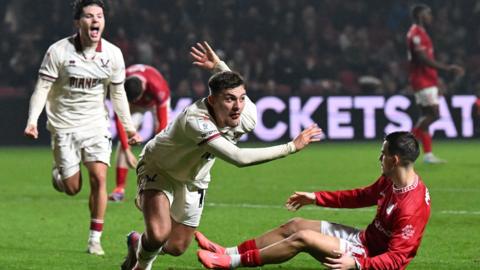 Harrison Burrows celebrates his late winner at Bristol City