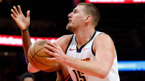 Nikola Jokic drives for the basket against the Atlanta Hawks