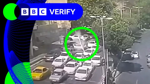 An annotated image showing a projectile about to hit cars in Tehran, Iran