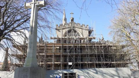 Exterior of St Mary Magdalene surrounded by scaffolding