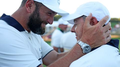 Jon Rahm embraces Rory McIlroy at the Ryder Cup