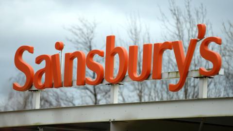 Stock image of an orange Sainsbury's sign