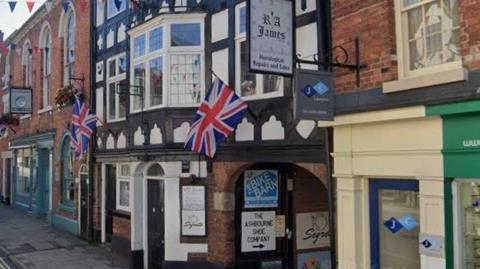 A street view of R A James in Ashbourne.