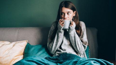 Woman drinking from mug