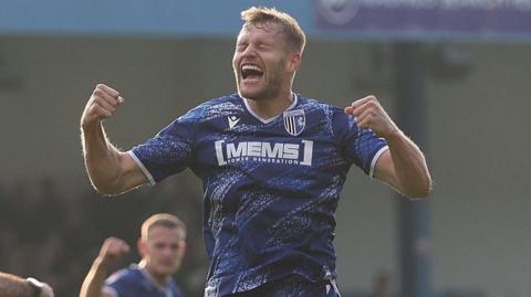 Elliott Nevitt has his eyes closed in celebration after his equaliser against Cheltenham