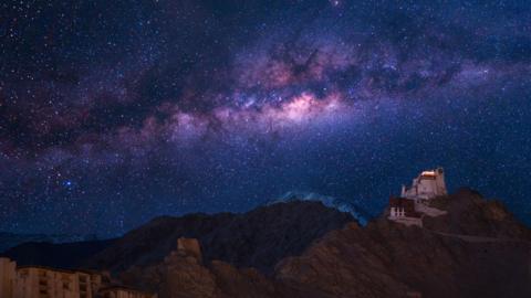 Extreme long exposure image showing milky way with Namgyal Tsemo Gompa, main buddhist monastery centre in Leh, Ladakh, India
