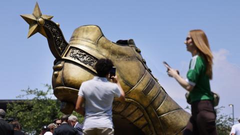 The City of Arlington, the Arlington Museum of Art, and the North Texas Sports Foundation held a ribbon cutting for the 'Texan Golden Boot sculpture, a permanent legacy installation at Stadium Drive and Cowboys Way in Arlington, May 28, 2026.