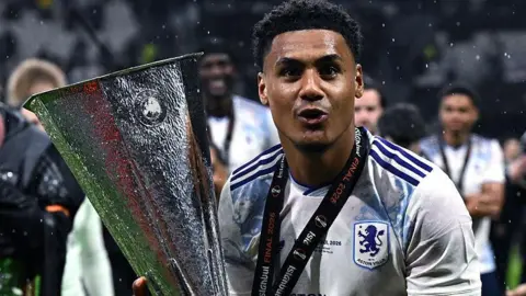 Ollie Watkins celebrates winning the Europa League