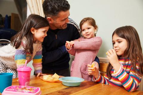 Father with three young daughters.