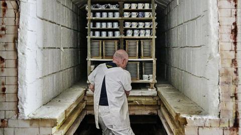 A worker at Middleport Pottery