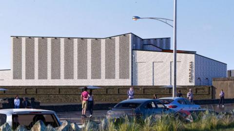 A computer drawn rendering of a grey building with an angled roof. The word "Tropicana" is placed vertically on the building.  