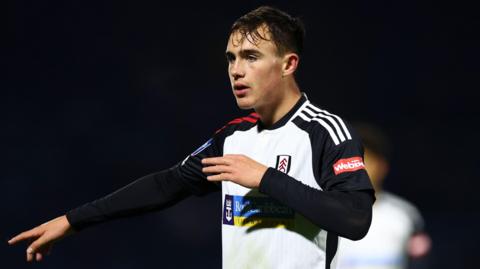 Fulham's Luke Harris makes a pointing gesture