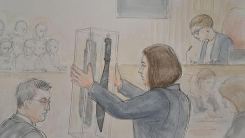 Court drawing of a machete being shown in court