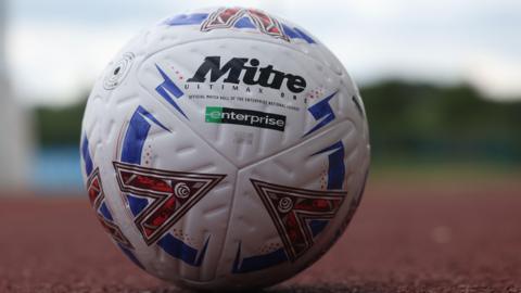 A National League matchball on an athletics track