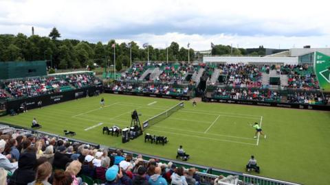 Crowd of people watch Nottingham Open tennis match