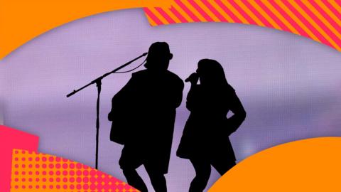 A silhouette of two musicians singing and playing guitar.