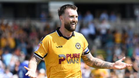 Kyle Cameron celebrates scoring for Newport