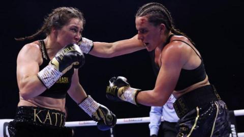 Katie Taylor and Chantelle Cameron fight in the ring