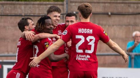 Rhys Hughes celebrates with his Connah's Quay Nomads team-mates 