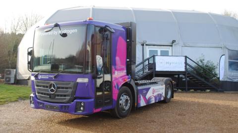A lorry of the type that is to be used in the HyHaul trial is parked up carrying markings procaiming its use of hydrogen fuel.