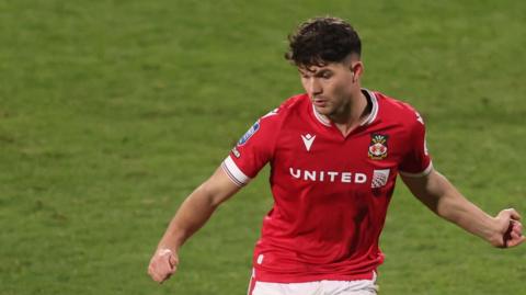 Jordan Davies in action for Wrexham against Burton in the EFL Trophy in December 2023