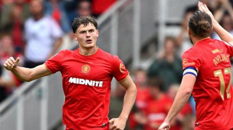 Will Lankshear (left) celebrates scoring for Middlesbrough against Lincoln