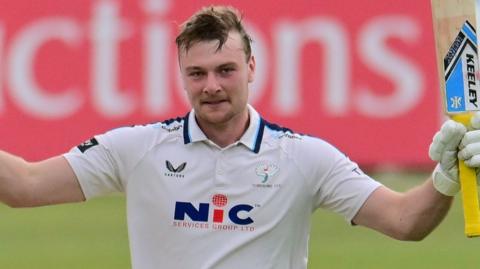 Finlay Bean celebrates scoring century