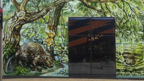 A mock-up artwork of a mural featuring two beavers.