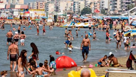 Holidaygoers on a beach in Albania