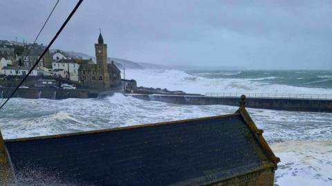 Waves crashing in Porthleven during Storm Kathleen. Large waves are building around the coast.