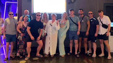 A group of family and friends from Liverpool posing for a picture outside a nightclub in the US as they soak up the World Cup atmosphere.
