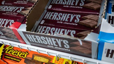 Hershey's chocolate bars and Reese's brand peanut butter cups at a store in the US.