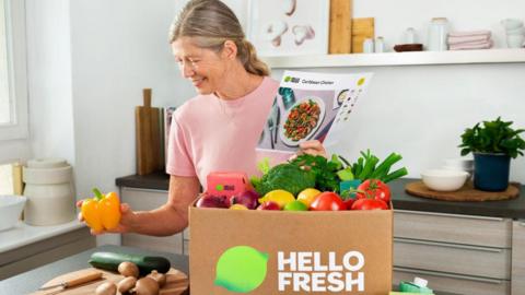 Woman with HelloFresh box