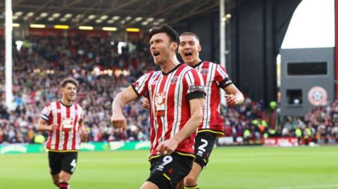 Kieffer Moore punching the air after scoring