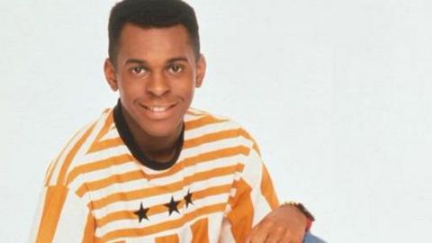 Andi Peters in a yellow and white striped t-shirt