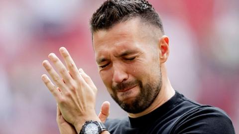Francesco Farioli is crying and clapping his hands