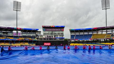 Groundstaff put the covers on in Colombo ahead of Australia v Sri Lanka at Women's Cricket World Cup