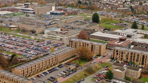 A general view of The Royal Shrewsbury Hospital on November 20, 2019 in Shrewsbury, England. We can see lots of buildings and some car parks. 