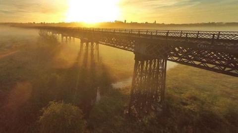 Bennerley Viaduct viewed during a misty morning sunrise