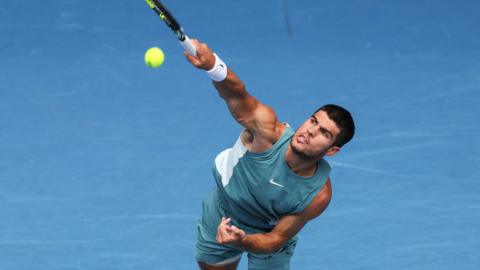 Carlos Alcaraz serves at the 2025 Australian Open