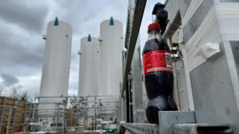 Fizzy drink bottle at a carbon capture power plant