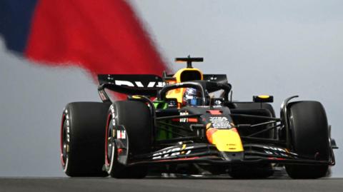 Red Bull's Max Verstappen in US Grand Prix practice with the Texas flag in the background