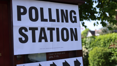 A sign reading 'polling station' outside a polling station in Cambridge 