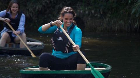 Women paddling coracles