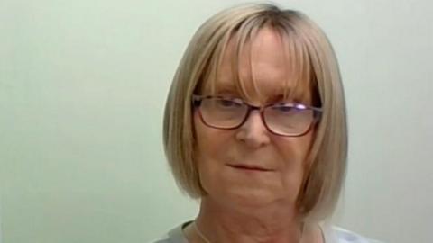 Steph Richards is pictured giving a Zoom interview to BBC Radio 4 in 2023. She has a blonde bob hairstyle and wears glasses.