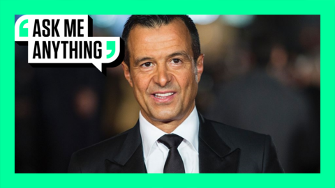 Football agent Jorge Mendes smiles on a red carpet