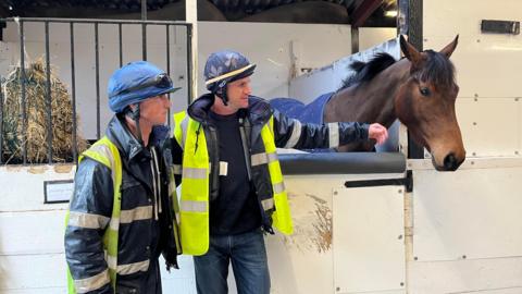 Two men and a horse