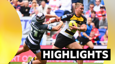 Liam Harris of York is tackled by George Flanagan Jr of Huddersfield
