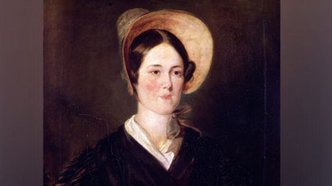 A painting portrait of Grace Darling who is pictured wearing a orange bonnet. 