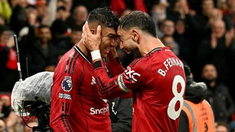 Casemiro and Bruno Fernandes embrace